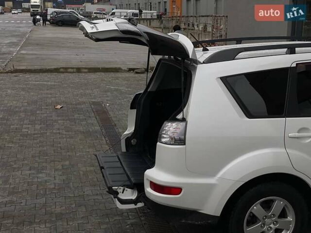 Білий Міцубісі Аутлендер, об'ємом двигуна 2 л та пробігом 248 тис. км за 10490 $, фото 44 на Automoto.ua