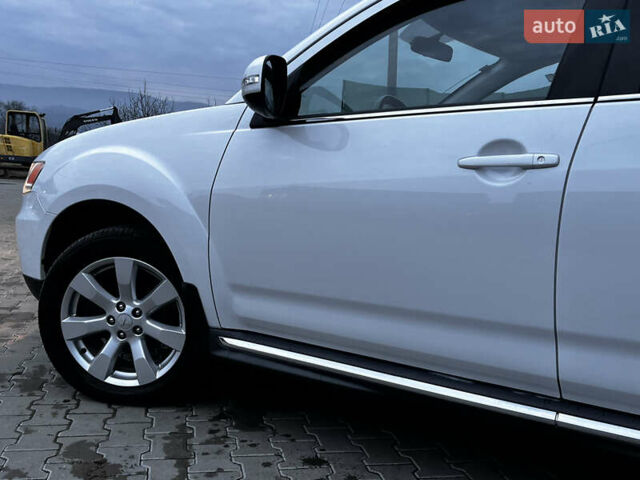 Белый Мицубиси Аутлендер, объемом двигателя 2.3 л и пробегом 161 тыс. км за 11150 $, фото 13 на Automoto.ua