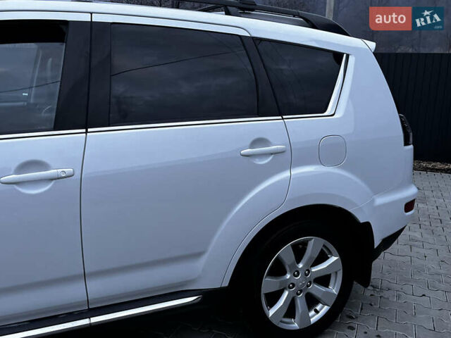Белый Мицубиси Аутлендер, объемом двигателя 2.3 л и пробегом 161 тыс. км за 11150 $, фото 12 на Automoto.ua
