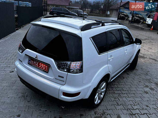 Белый Мицубиси Аутлендер, объемом двигателя 2.3 л и пробегом 161 тыс. км за 11150 $, фото 18 на Automoto.ua