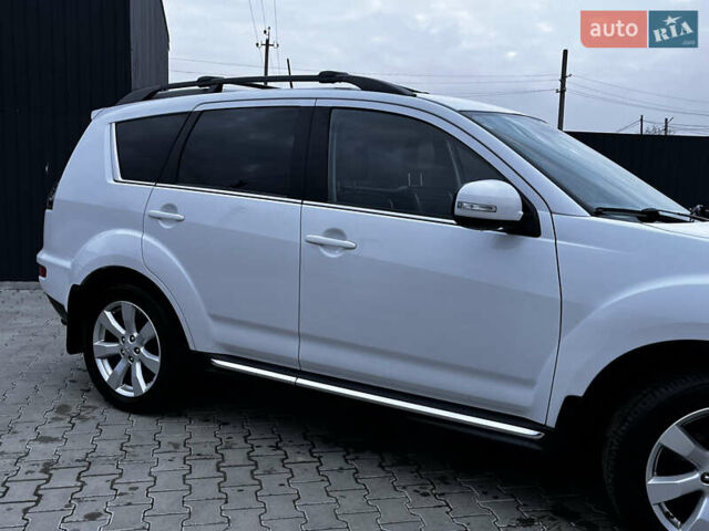 Белый Мицубиси Аутлендер, объемом двигателя 2.3 л и пробегом 161 тыс. км за 11150 $, фото 7 на Automoto.ua
