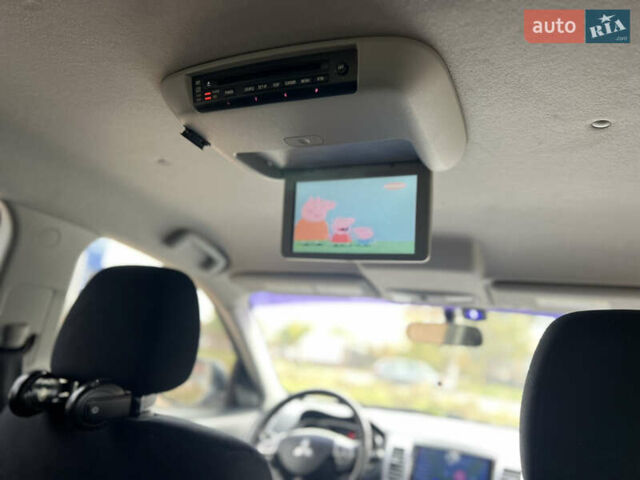 Білий Міцубісі Аутлендер, об'ємом двигуна 2.36 л та пробігом 260 тис. км за 9700 $, фото 27 на Automoto.ua