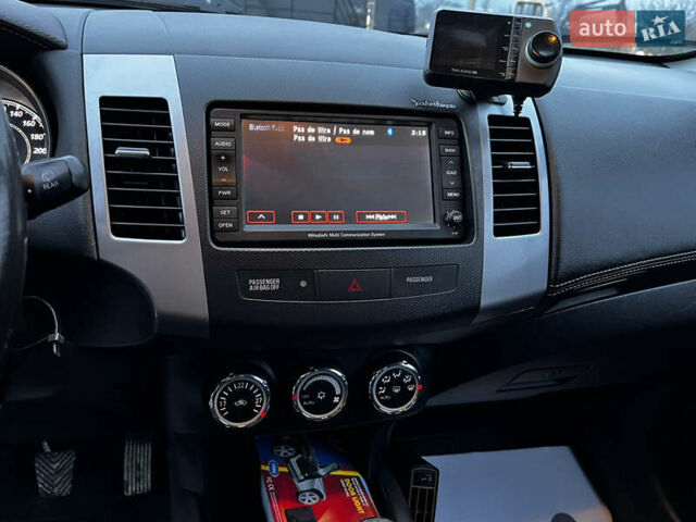 Белый Мицубиси Аутлендер, объемом двигателя 2.3 л и пробегом 161 тыс. км за 11150 $, фото 25 на Automoto.ua