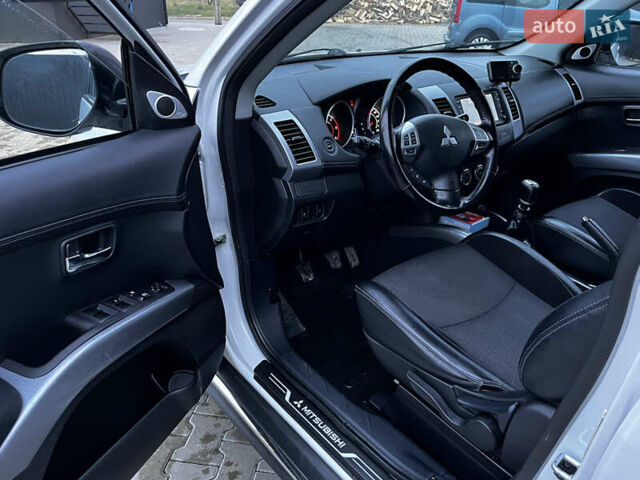 Белый Мицубиси Аутлендер, объемом двигателя 2.3 л и пробегом 161 тыс. км за 11150 $, фото 21 на Automoto.ua