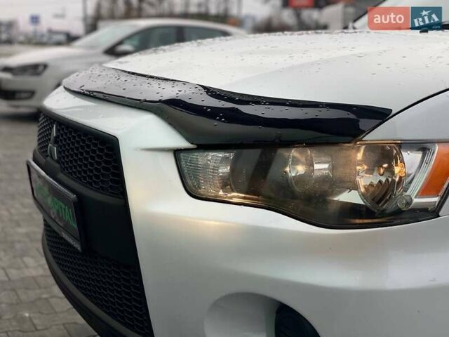 Білий Міцубісі Аутлендер, об'ємом двигуна 2 л та пробігом 248 тис. км за 10490 $, фото 14 на Automoto.ua