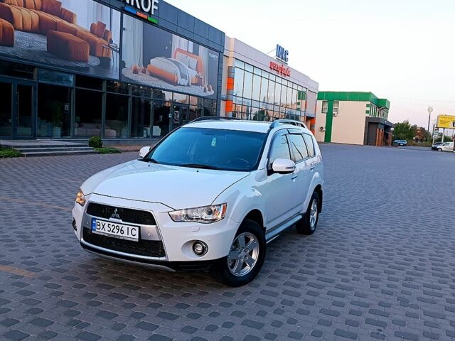 Белый Мицубиси Аутлендер, объемом двигателя 2.4 л и пробегом 187 тыс. км за 9700 $, фото 1 на Automoto.ua