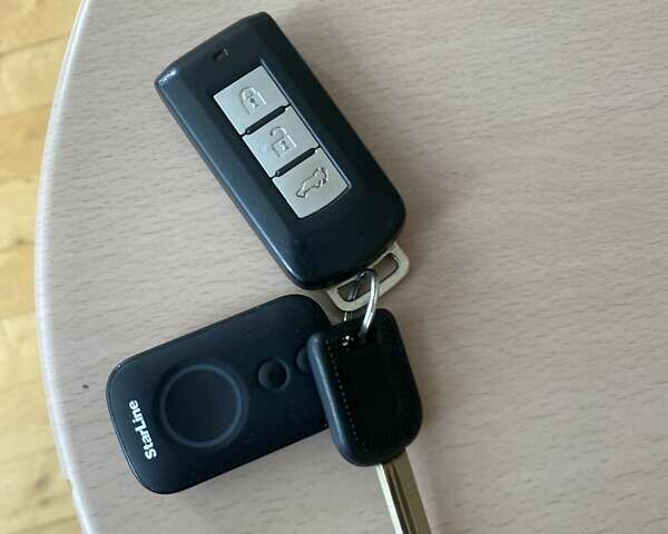 Белый Мицубиси Аутлендер, объемом двигателя 2.36 л и пробегом 152 тыс. км за 11500 $, фото 20 на Automoto.ua