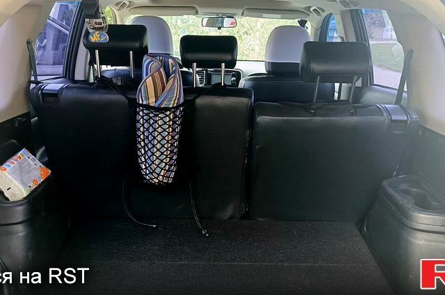 Белый Мицубиси Аутлендер, объемом двигателя 2.4 л и пробегом 300 тыс. км за 12500 $, фото 6 на Automoto.ua