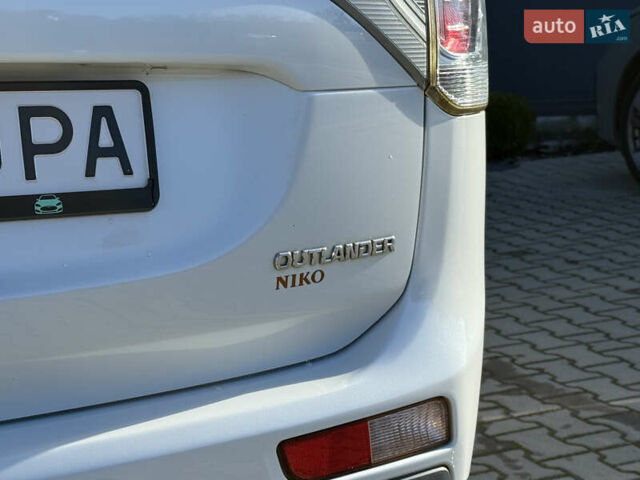 Белый Мицубиси Аутлендер, объемом двигателя 2.4 л и пробегом 148 тыс. км за 12900 $, фото 12 на Automoto.ua