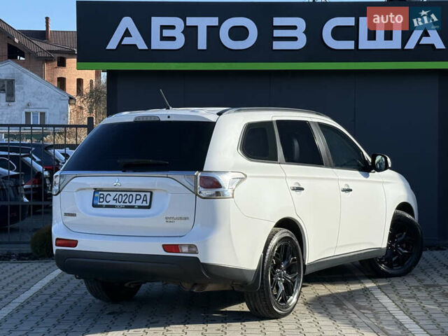Белый Мицубиси Аутлендер, объемом двигателя 2.4 л и пробегом 148 тыс. км за 12900 $, фото 1 на Automoto.ua