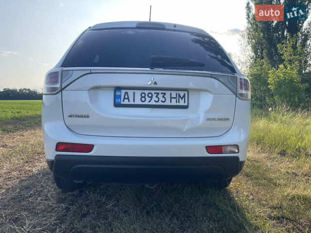 Белый Мицубиси Аутлендер, объемом двигателя 2.4 л и пробегом 168 тыс. км за 10499 $, фото 5 на Automoto.ua