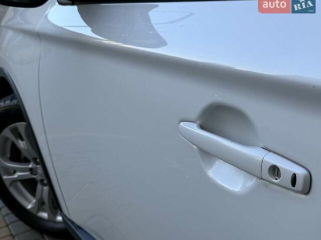 Белый Мицубиси Аутлендер, объемом двигателя 2.36 л и пробегом 140 тыс. км за 12999 $, фото 21 на Automoto.ua