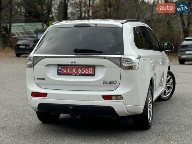 Белый Мицубиси Аутлендер, объемом двигателя 2 л и пробегом 210 тыс. км за 14300 $, фото 33 на Automoto.ua