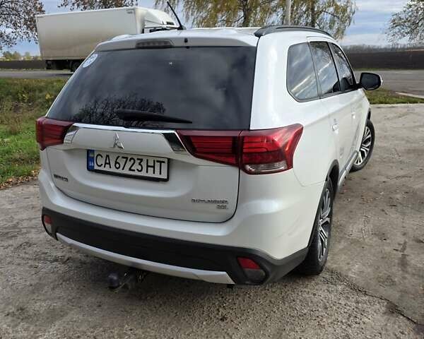 Белый Мицубиси Аутлендер, объемом двигателя 2.36 л и пробегом 169 тыс. км за 13300 $, фото 9 на Automoto.ua