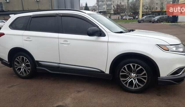 Белый Мицубиси Аутлендер, объемом двигателя 2.4 л и пробегом 240 тыс. км за 14900 $, фото 7 на Automoto.ua