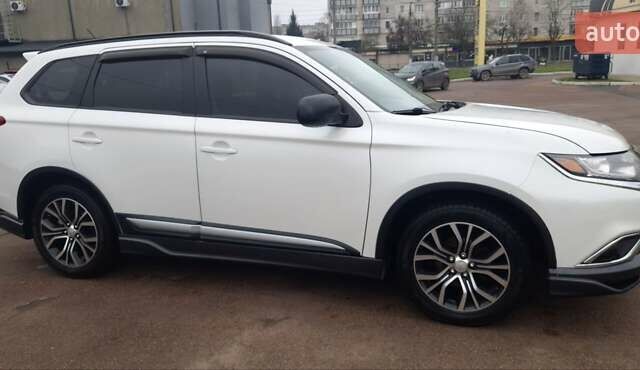 Белый Мицубиси Аутлендер, объемом двигателя 2.4 л и пробегом 240 тыс. км за 14900 $, фото 6 на Automoto.ua