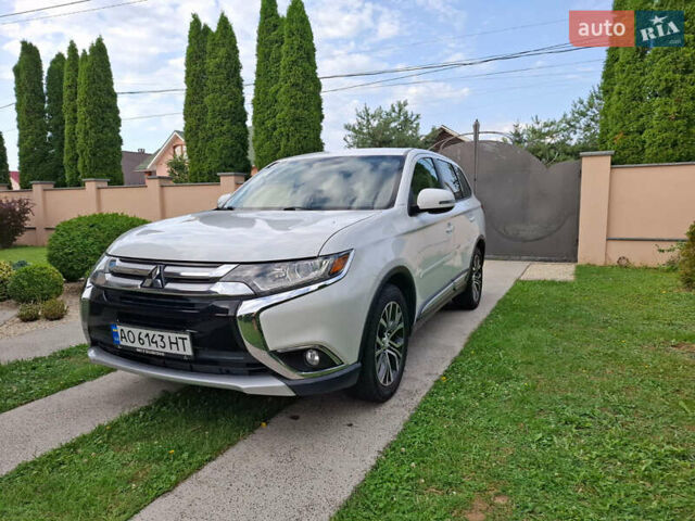 Белый Мицубиси Аутлендер, объемом двигателя 2.4 л и пробегом 145 тыс. км за 14900 $, фото 1 на Automoto.ua