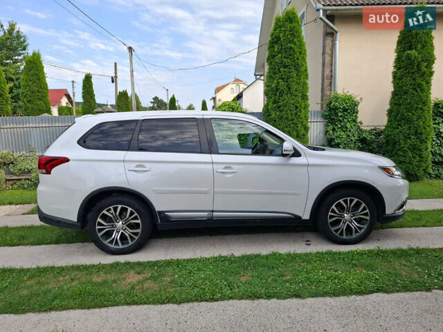 Белый Мицубиси Аутлендер, объемом двигателя 2.4 л и пробегом 145 тыс. км за 14900 $, фото 5 на Automoto.ua