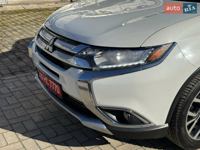 Білий Міцубісі Аутлендер, об'ємом двигуна 2.4 л та пробігом 178 тис. км за 12750 $, фото 19 на Automoto.ua