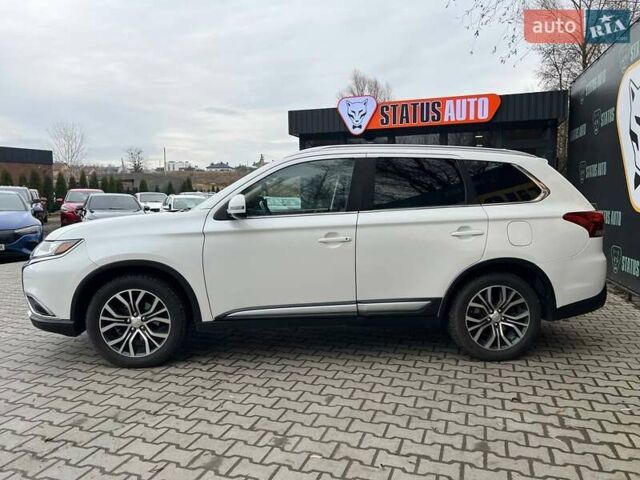 Белый Мицубиси Аутлендер, объемом двигателя 2.36 л и пробегом 153 тыс. км за 15700 $, фото 4 на Automoto.ua