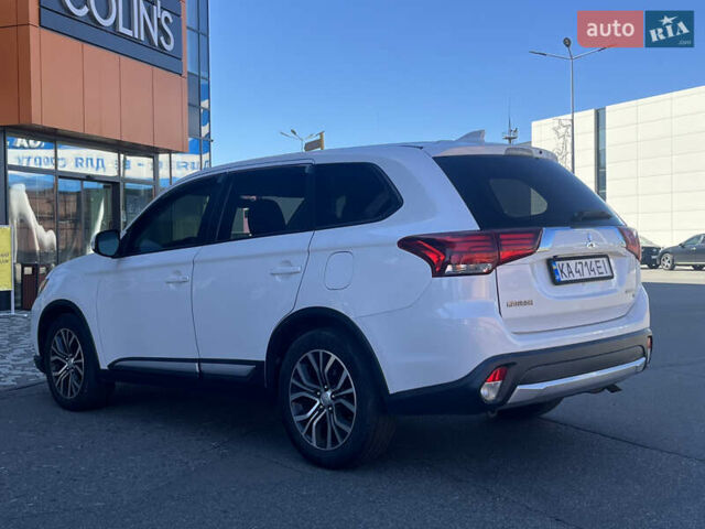 Белый Мицубиси Аутлендер, объемом двигателя 2.4 л и пробегом 210 тыс. км за 13550 $, фото 4 на Automoto.ua