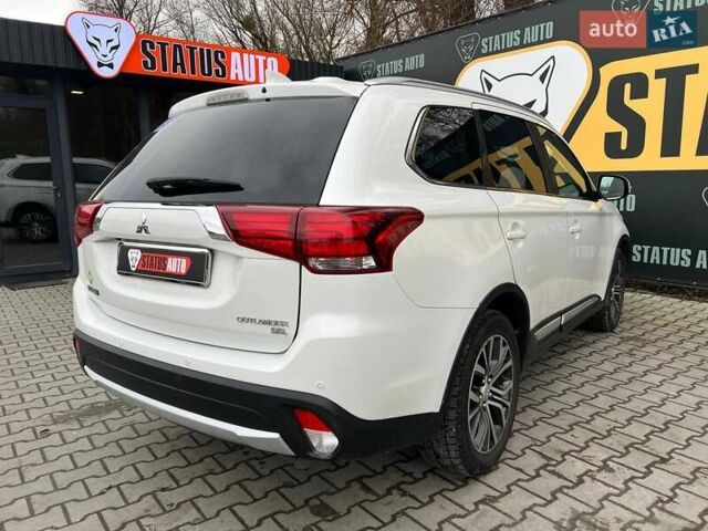 Белый Мицубиси Аутлендер, объемом двигателя 2.36 л и пробегом 153 тыс. км за 15700 $, фото 7 на Automoto.ua