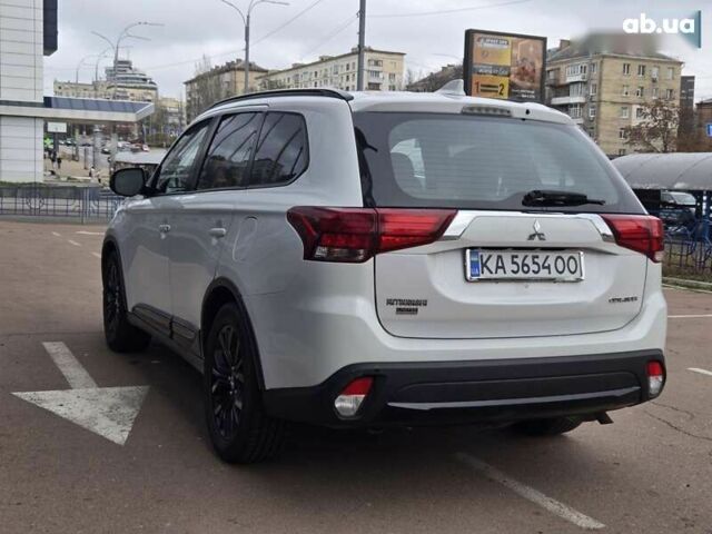 Белый Мицубиси Аутлендер, объемом двигателя 2.4 л и пробегом 115 тыс. км за 19300 $, фото 4 на Automoto.ua