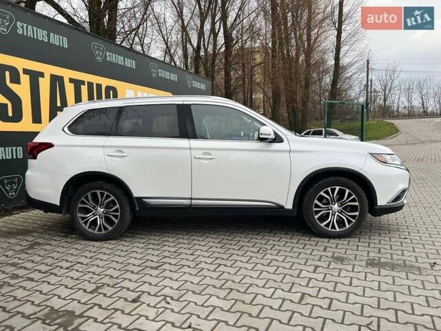 Белый Мицубиси Аутлендер, объемом двигателя 2.36 л и пробегом 153 тыс. км за 15700 $, фото 5 на Automoto.ua