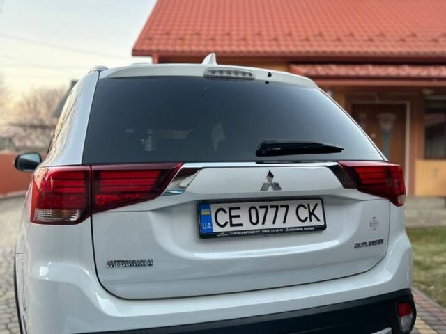 Білий Міцубісі Аутлендер, об'ємом двигуна 2 л та пробігом 161 тис. км за 18000 $, фото 2 на Automoto.ua