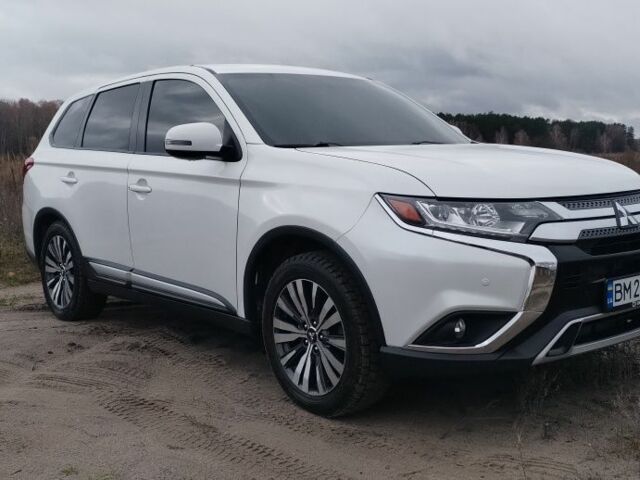 Белый Мицубиси Аутлендер, объемом двигателя 2.4 л и пробегом 122 тыс. км за 17400 $, фото 2 на Automoto.ua