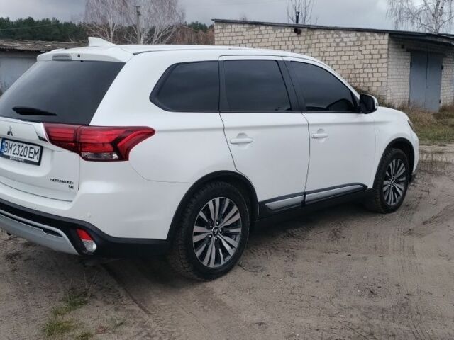 Белый Мицубиси Аутлендер, объемом двигателя 2.4 л и пробегом 122 тыс. км за 17400 $, фото 4 на Automoto.ua