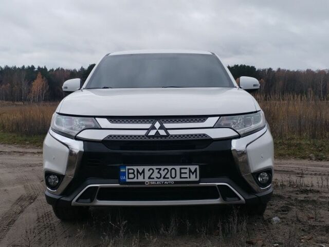 Белый Мицубиси Аутлендер, объемом двигателя 2.4 л и пробегом 122 тыс. км за 17400 $, фото 1 на Automoto.ua