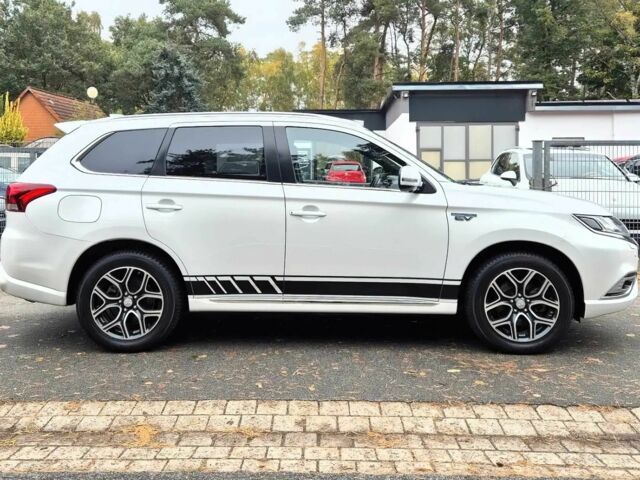 Белый Мицубиси Аутлендер, объемом двигателя 2.4 л и пробегом 42 тыс. км за 6000 $, фото 5 на Automoto.ua