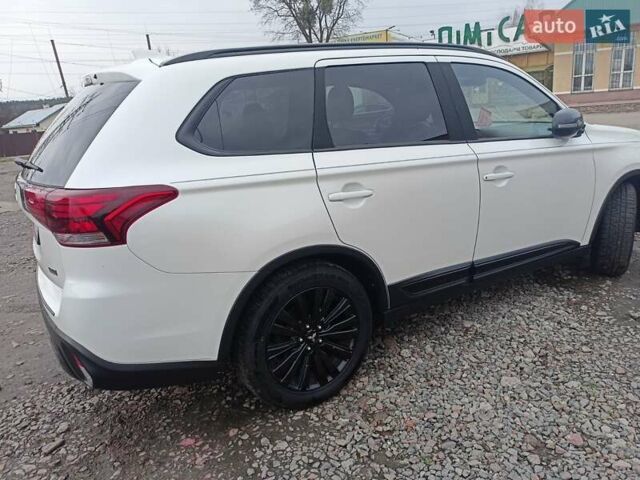 Білий Міцубісі Аутлендер, об'ємом двигуна 2.36 л та пробігом 170 тис. км за 18200 $, фото 2 на Automoto.ua