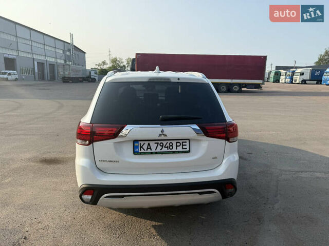 Білий Міцубісі Аутлендер, об'ємом двигуна 2.36 л та пробігом 84 тис. км за 19999 $, фото 11 на Automoto.ua