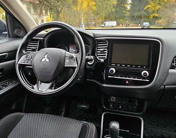 Білий Міцубісі Аутлендер, об'ємом двигуна 2 л та пробігом 74 тис. км за 16500 $, фото 14 на Automoto.ua