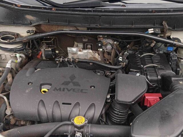 Бежевий Міцубісі Аутлендер, об'ємом двигуна 2.4 л та пробігом 290 тис. км за 6800 $, фото 8 на Automoto.ua