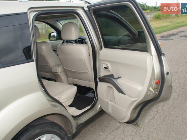 Бежевий Міцубісі Аутлендер, об'ємом двигуна 2.36 л та пробігом 207 тис. км за 10800 $, фото 39 на Automoto.ua