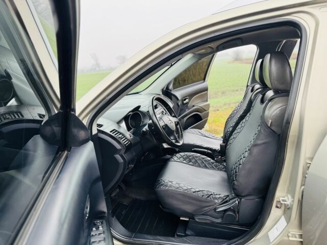 Бежевый Мицубиси Аутлендер, объемом двигателя 2.4 л и пробегом 107 тыс. км за 9900 $, фото 7 на Automoto.ua