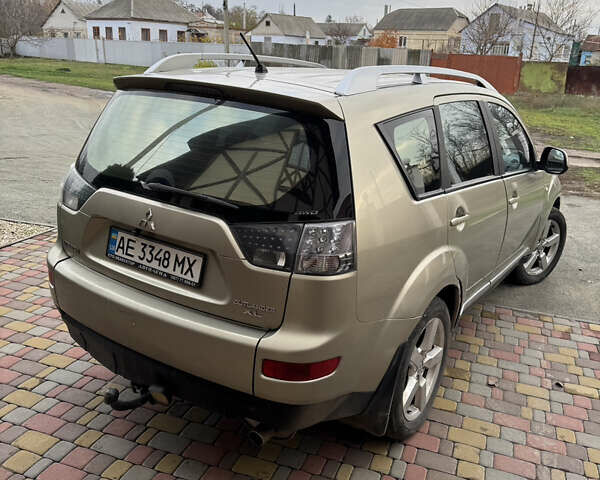 Бежевий Міцубісі Аутлендер, об'ємом двигуна 2.4 л та пробігом 301 тис. км за 6100 $, фото 4 на Automoto.ua
