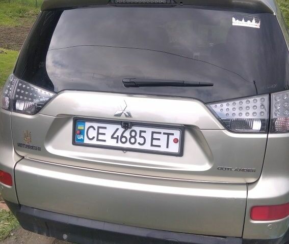 Бежевий Міцубісі Аутлендер, об'ємом двигуна 2 л та пробігом 330 тис. км за 9100 $, фото 3 на Automoto.ua