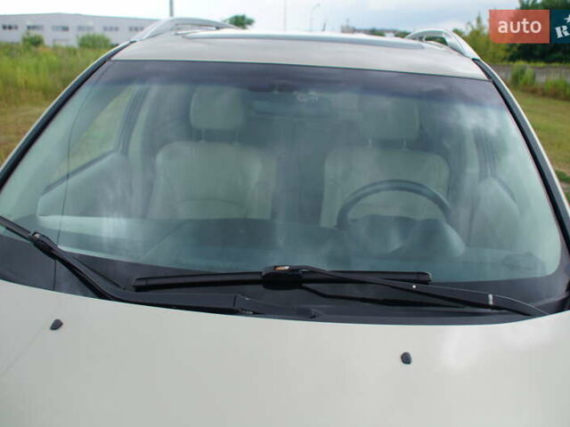 Бежевий Міцубісі Аутлендер, об'ємом двигуна 2.36 л та пробігом 207 тис. км за 10800 $, фото 66 на Automoto.ua