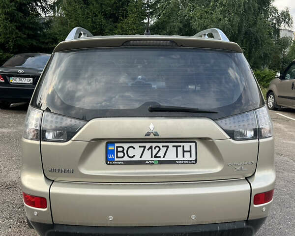 Бежевий Міцубісі Аутлендер, об'ємом двигуна 2.4 л та пробігом 252 тис. км за 8500 $, фото 3 на Automoto.ua