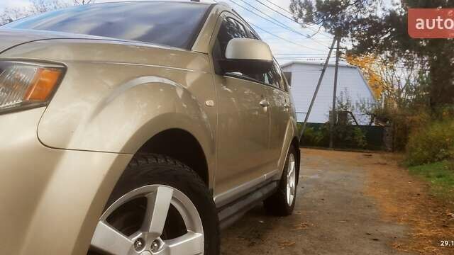 Бежевий Міцубісі Аутлендер, об'ємом двигуна 2.36 л та пробігом 240 тис. км за 9250 $, фото 4 на Automoto.ua