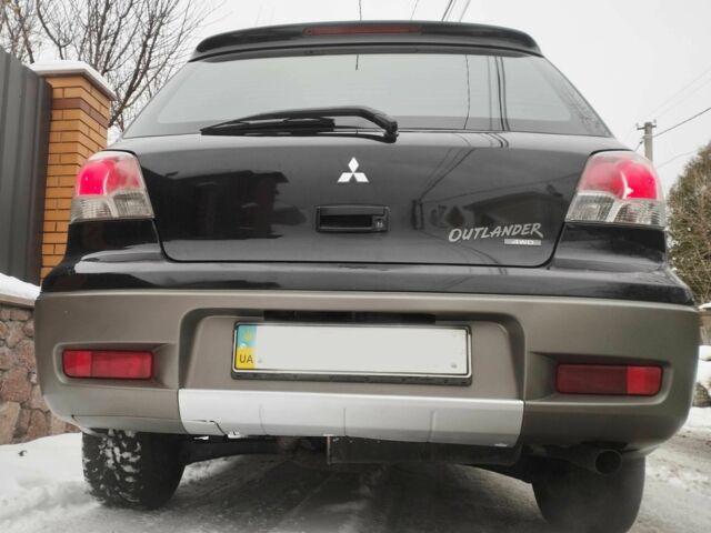 Чорний Міцубісі Аутлендер, об'ємом двигуна 2 л та пробігом 251 тис. км за 4990 $, фото 9 на Automoto.ua
