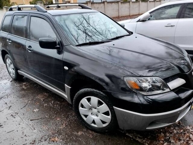 Чорний Міцубісі Аутлендер, об'ємом двигуна 2 л та пробігом 251 тис. км за 4990 $, фото 18 на Automoto.ua