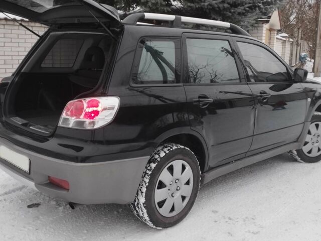 Чорний Міцубісі Аутлендер, об'ємом двигуна 2 л та пробігом 251 тис. км за 4990 $, фото 13 на Automoto.ua