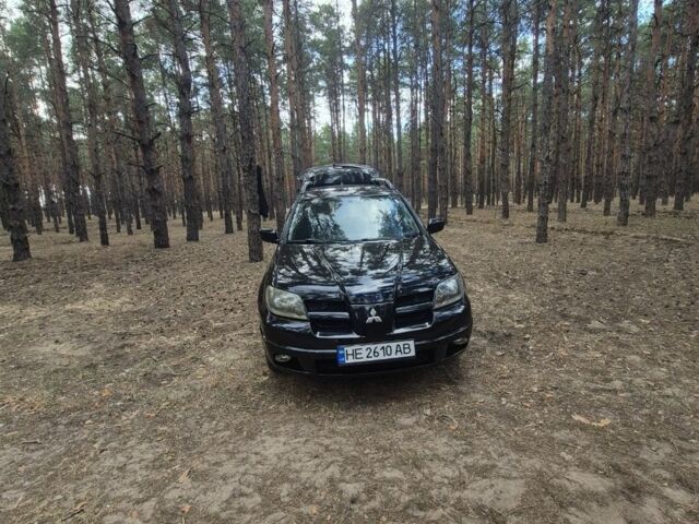 Черный Мицубиси Аутлендер, объемом двигателя 2.4 л и пробегом 312 тыс. км за 6500 $, фото 4 на Automoto.ua