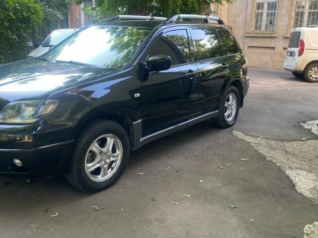 Черный Мицубиси Аутлендер, объемом двигателя 2.4 л и пробегом 312 тыс. км за 6500 $, фото 5 на Automoto.ua