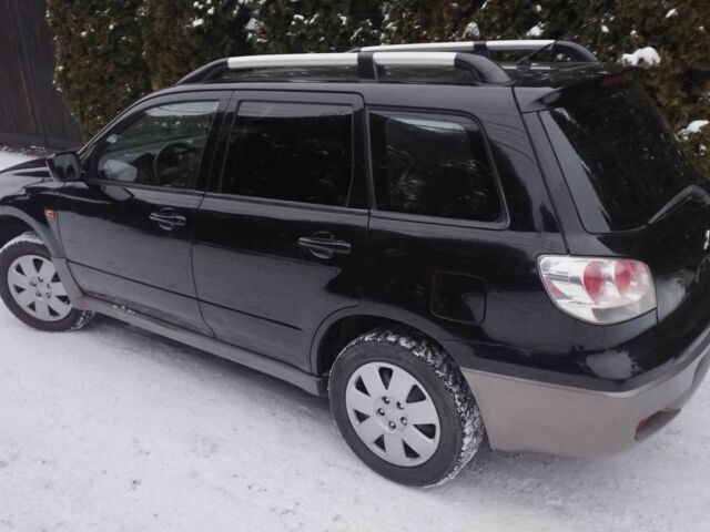 Чорний Міцубісі Аутлендер, об'ємом двигуна 2 л та пробігом 251 тис. км за 4990 $, фото 3 на Automoto.ua